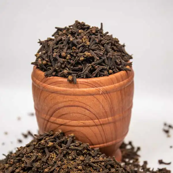 Organic Cloves Whole 3 Organic Cloves Whole in an african small mortar