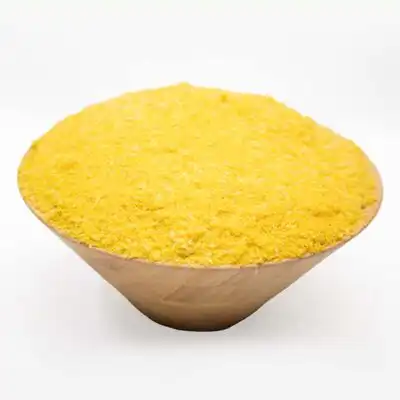 A wooden bowl of Wholesale Yellow Garri Online from Baobabmart