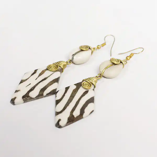 Cowrie earrings dangling in a zebra pattern diamond shape2 Cowrie Earrings Dangling in a Diamond Shape – Handcrafted African Jewelry at Baobabmart