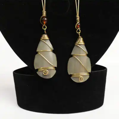 Stylish Ox Horn Earrings Decorated with Brown Beads - Available at Baobabmart