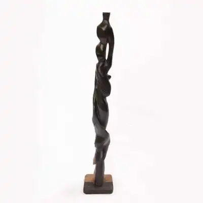 Statue of African Woman with a Jar on Head, handcrafted with cultural precision, symbolizing grace and resourcefulness, available at BaobabMart.
