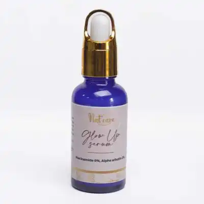 Nat Care Glow Up Serum, enriched with niacinamide and alpha arbutin for brighter, smoother skin, available at BaobabMart.