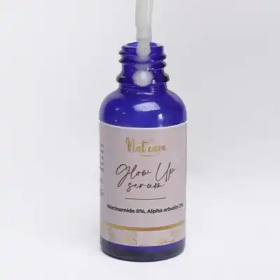 Nat Care Glow Up Serum, enriched with niacinamide and alpha arbutin for brighter, smoother skin, available at BaobabMart.