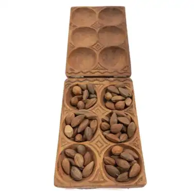 Enhance your space with the Square Mancala African Game Board, a stunning traditional piece for play or display. Order today at BaobabMart!