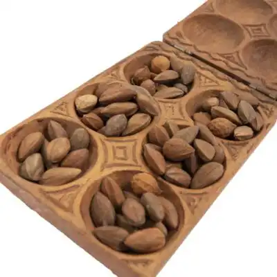 Enhance your space with the Square Mancala African Game Board, a stunning traditional piece for play or display. Order today at BaobabMart!
