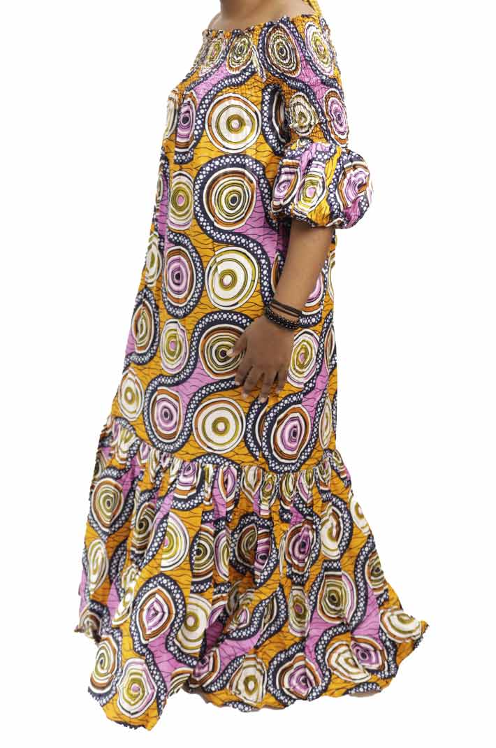 Long wax dress with trees patterns and elastic boat neckline 6 Long Women Wax Dress with Trees Patterns, elegant African wax print dress for formal and cultural events, available at BaobabMart.