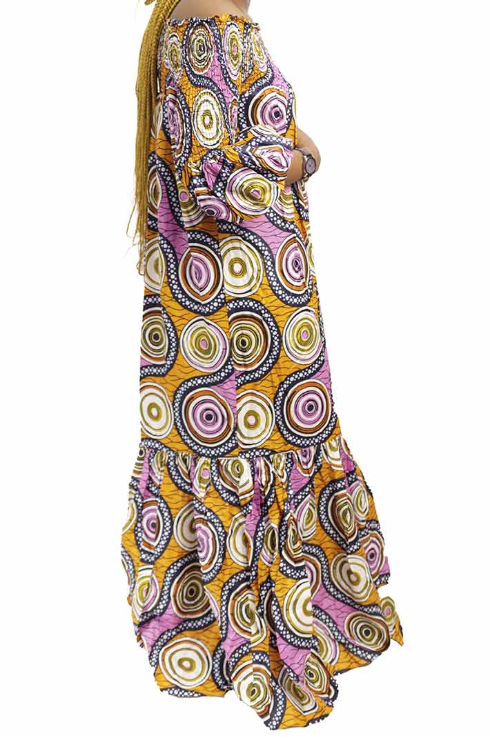 Long wax dress with trees patterns and elastic boat neckline 7 Long Women Wax Dress with Trees Patterns, elegant African wax print dress for formal and cultural events, available at BaobabMart.