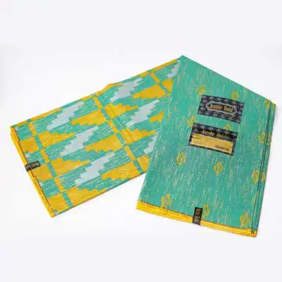 Close-up of Green Kente Gold Wax Fabric for Sale showing Kente prints