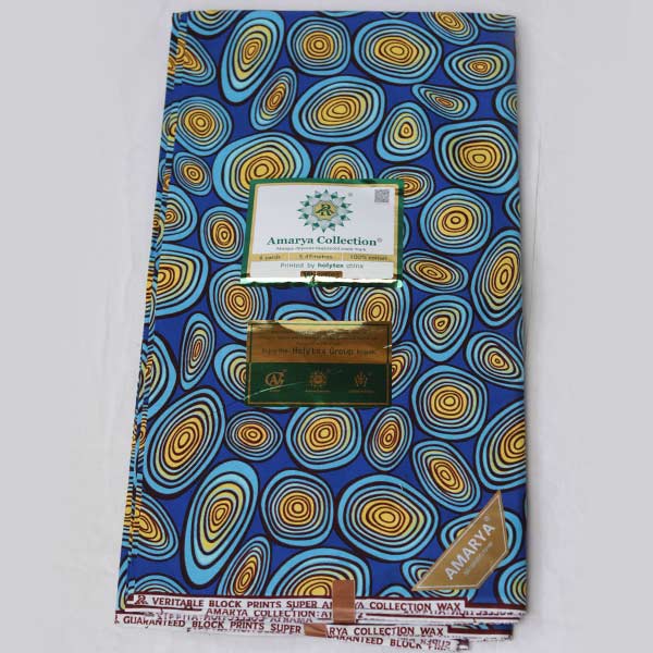 Amaraya Collection blue fabric with yellowish prints 1 Close-up of Amaraya Collection Blue Fabric with Yellowish Prints showing design