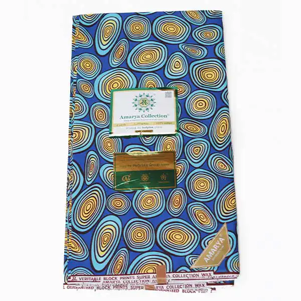 Close-up of Amaraya Collection Blue Fabric with Yellowish Prints showing design