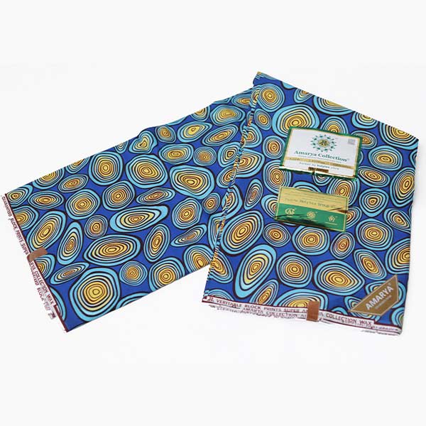 Amaraya Collection blue fabric with yellowish prints 3 Close-up of Amaraya Collection Blue Fabric with Yellowish Prints showing design