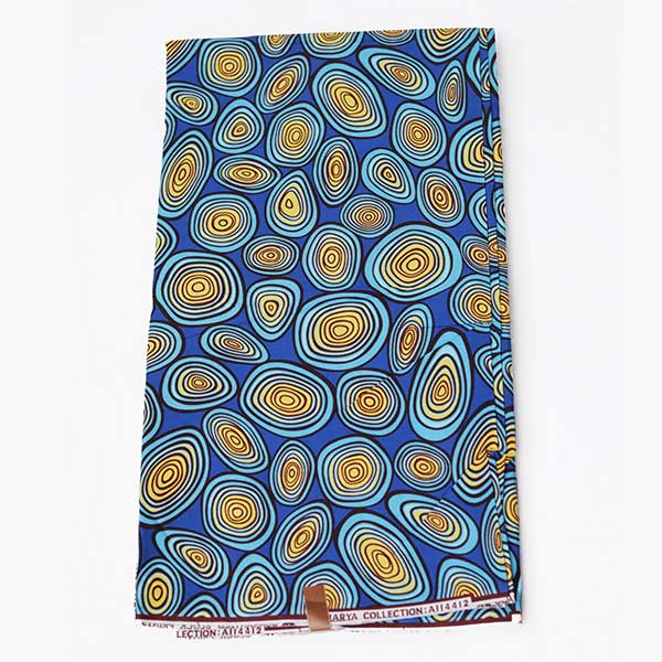 Amaraya Collection blue fabric with yellowish prints 4 Close-up of Amaraya Collection Blue Fabric with Yellowish Prints showing design