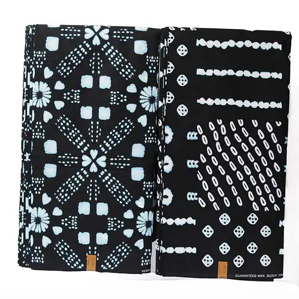 Tissu Hitarget noir avec dés et cercles imprimés 7 Tissu Hitarget noir avec dés et cercles imprimés – tissu audacieux et élégant disponible chez BaobabMart.