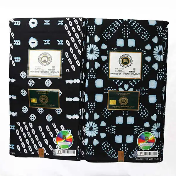 Tissu Hitarget noir avec dés et cercles imprimés 8 Tissu Hitarget noir avec dés et cercles imprimés – tissu audacieux et élégant disponible chez BaobabMart.
