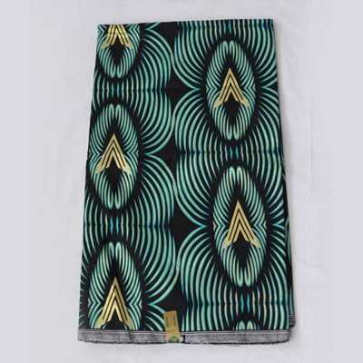 Close-up of Black Prince Fabric with Green Black and Gold Prints showing gold prints