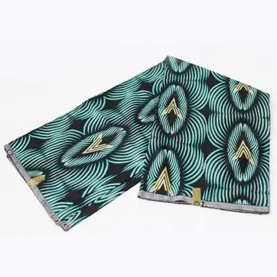 Close-up of Black Prince Fabric with Green Black and Gold Prints showing gold prints