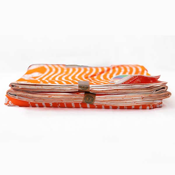Hitarget XO orange fabric 2 African Hitarget XO Orange Fabric for Sale with zesty orange XO prints at Baobabmart