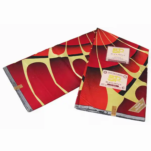 Tissu Prince Rouge Noir avec Motifs Dorés et Noirs – tissu audacieux et élégant disponible chez BaobabMart.