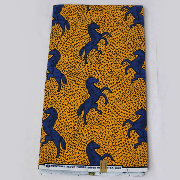 Yellow Hollantex fabric with blue horse print 1 Close-up of Yellow Hollantex Fabric with Blue Horse Print showing horse design