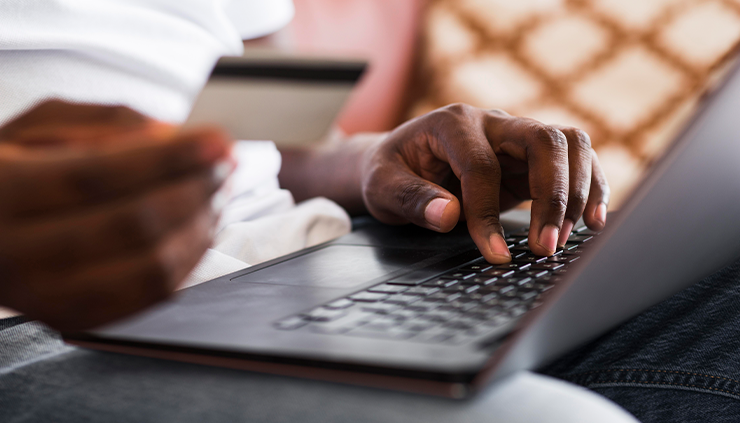 Laptop showing man purchasing red kola nuts and bitter kola nut on Baobabmart - Baobabmart article Red Kola Nuts vs Bitter Kola Nuts